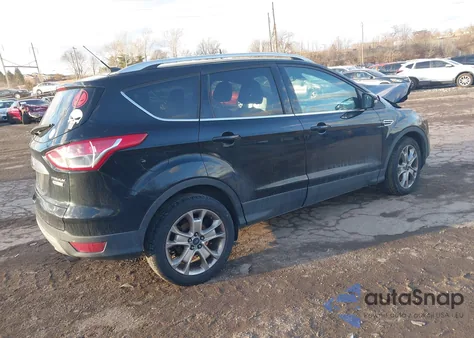 2016 Ford Escape Titanium z USA, uszkodzony, nr VIN 1FMCU0J91GUB36876
